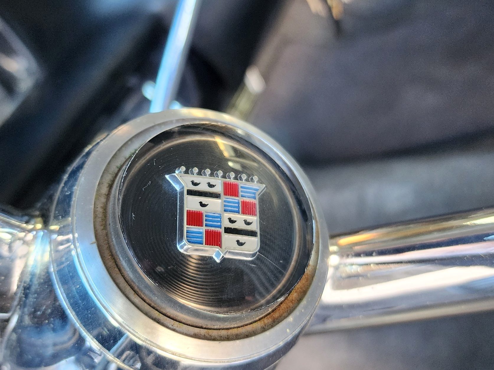 The Cadillac crest on the horn button